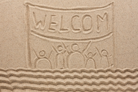 Word welcome written on the sand as the backgroundの写真素材
