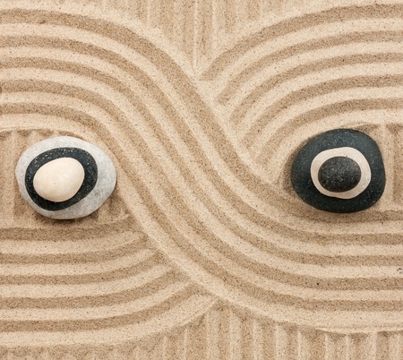 Two pyramid made of  stones standing on the sand, as background