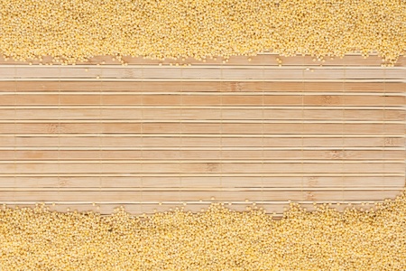 millet on a bamboo mat and place for text