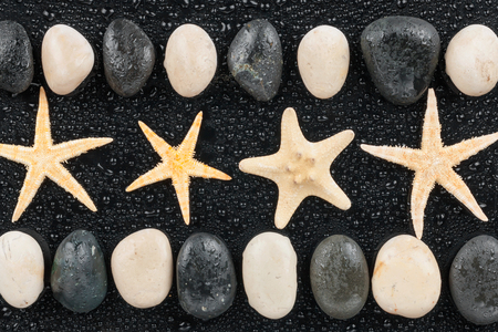 zen stones and starfish with water drops,with space for textの写真素材