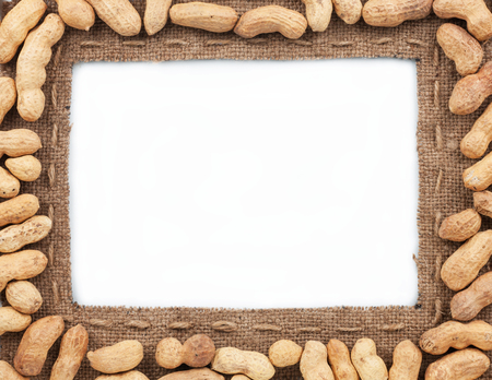 Frame made of burlap with peanut, on a white background