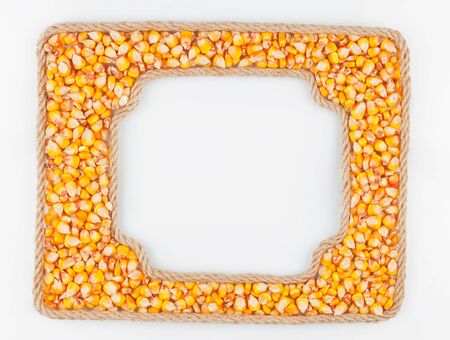Two frames of the rope with corn  grain on a white background, with place for your textの写真素材