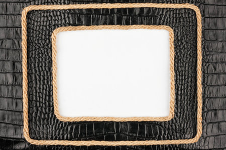 Two frame of rope, lies on a background of a black natural leather, with place for your textの写真素材