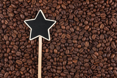 Pointer, the sign lies on coffee  beans,  with space for your textの写真素材