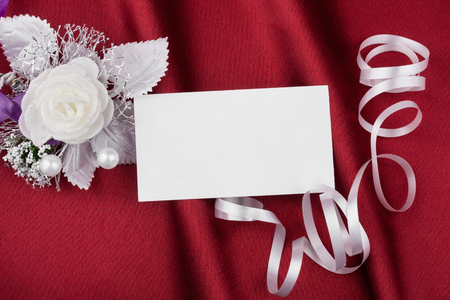 Wedding picture with a card on a red backgroundの写真素材