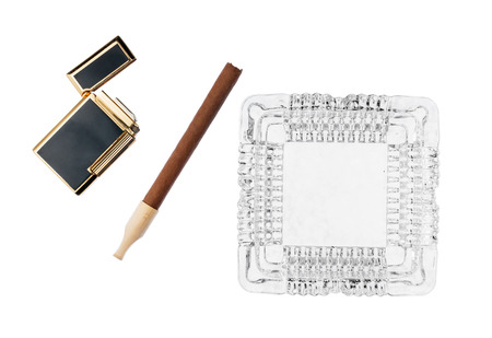 Ashtray with cigar and gold cigarette lighter, isolated on white backgroundの写真素材