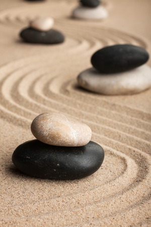 Pyramid  made of  stones standing on the sand, as background