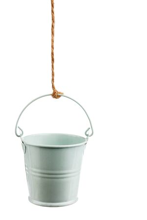 Iron bucket on a rope, isolated on white backgroundの写真素材