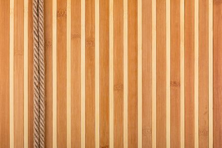 Two  rope lying on a bamboo mat, with a place for your text