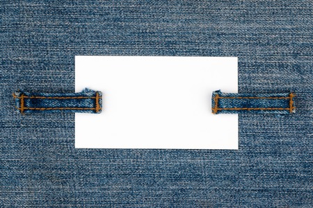 Empty business card with two jeans straps. With space for textの写真素材