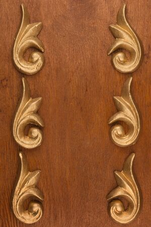 Frame of plaster decorative stucco molding on a wooden background Top viewの写真素材