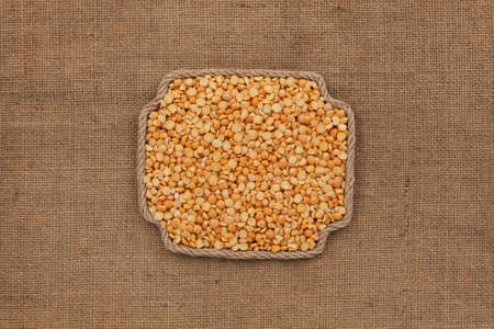Frame made of rope with a whole, ripe peas grain. With space for design, text place. Top viewの写真素材