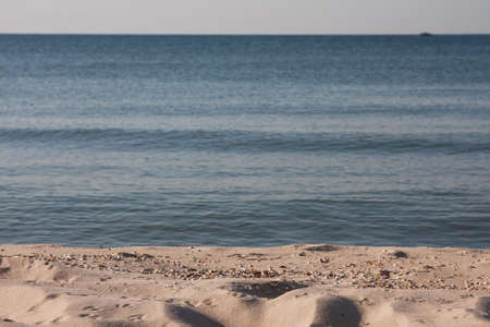 Tropical beach view. Calm and relaxing empty beach scene, blue sky and white sand. No peopleの写真素材