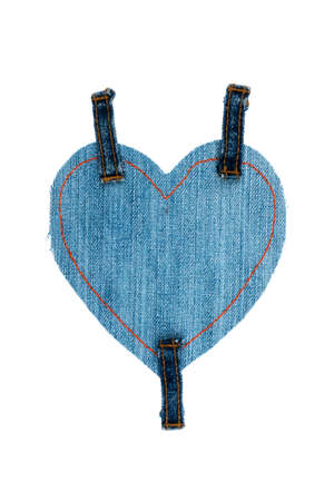 Denim heart with three straps isolated on white background. Ripped denim heart frame on white background. Denim fashionの写真素材