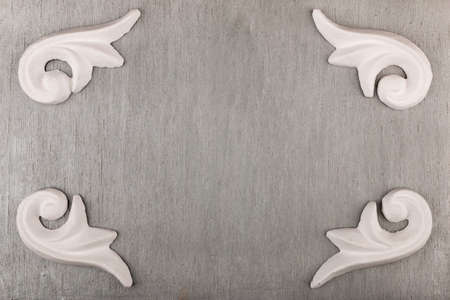 White stucco molding on an empty silver background. With space for design, text place. Top viewの写真素材