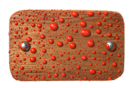 Old wooden board with drops of red paint. Isolated on white background.の写真素材