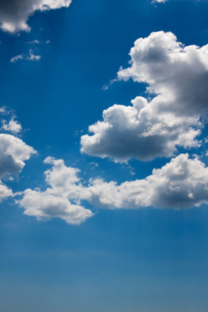 Beautiful blue sky with sunbeams and clouds. Sun rays. Sunny cloudsの写真素材