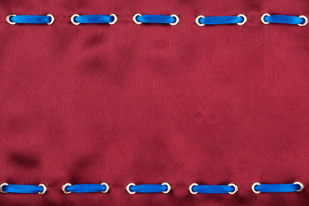 Satin fabric with an inserted satin ribbon. Fashion background. With space for design, text place. Top viewの写真素材