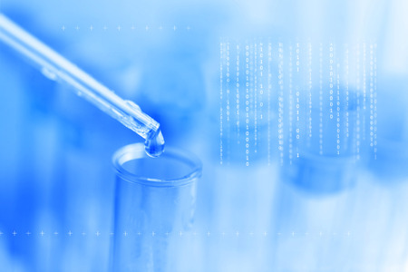 A pipette dropping sample into a test tube,abstract science background