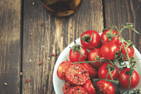 Cherry Tomatoes over wooden deskの写真素材