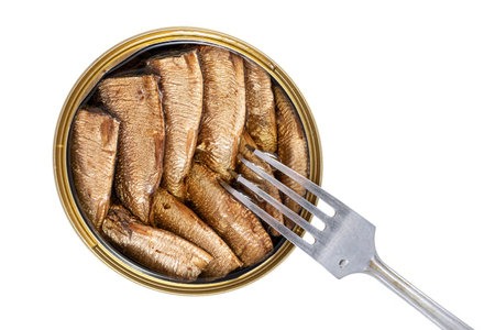 Sprats fish in a metal jar on a white background, Top view flat layout, isolated