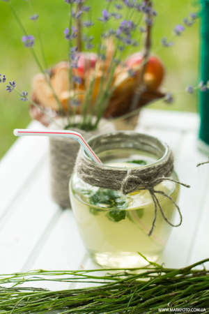 table decoration with flowers, food in a pine forestの写真素材