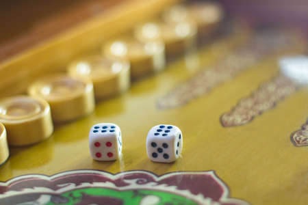 Dices set.Play backgammon table game.Rolling dice in old board game.