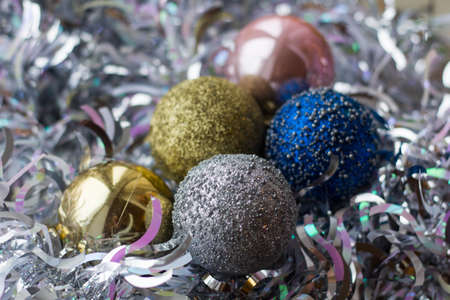 Christmas decorations on the tree in the form of colorful balls.の写真素材
