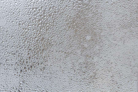 Rain drops on the window glass closeup.の写真素材