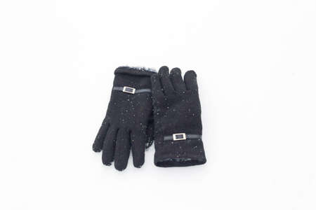 Women's gloves in snowy weather close up.の写真素材