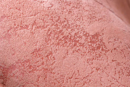 Burgundy fabric close-up sofa with a variety of patterns.の写真素材