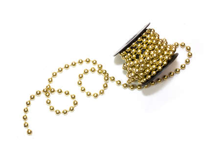 the coil is wrapped with bead thread, decoration closeup on a white background.の写真素材