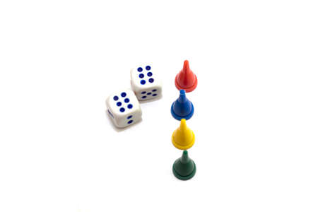 Gambling dices falling down against white backgroundの写真素材