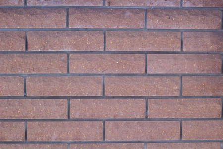 Background of red brick wall pattern texture. Great for graffiti inscriptions.の写真素材