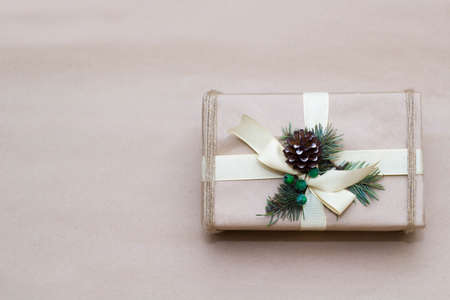 Vintage gift box in craft paper background. Present decorated with natural partsの写真素材