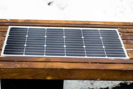 Bench with solar panel on street close-up