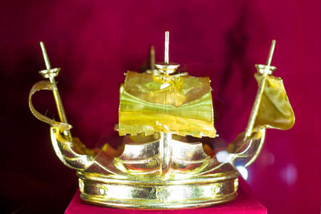 Gold and jewell-studded Kings crown close-up in the galleryの写真素材