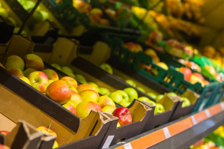 Fruit shop.Apples on the shelvesの写真素材
