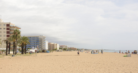 Santa Susanna,Spain-September 17,2014: Tourists walking and sunbathing on the beachのeditorial素材