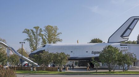 Moscow, Russia- October 5, 2015: Spectators visiting the space shuttle "Buran" at the VDNH( Exhibition of Economic Achievements),some of them are resting on benchesのeditorial素材