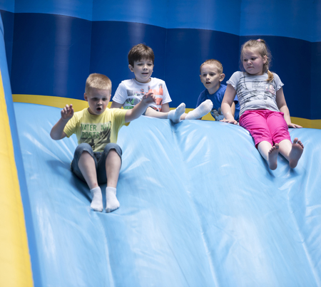 Rostov-on-Don, Russia- June 13: Children slide down inflatable slides at an amusement parkのeditorial素材