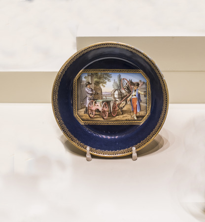 Moscow, Russia -September 08,2016:  Dinner set tete-a-tet. Saksoniya. Plate with a picture of the driver with the master. Museum of the Patriotic War of 1812のeditorial素材