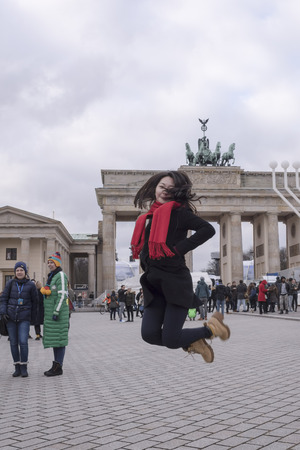 Berlin,Bundesrepublik Deutschland- December 29,2016: Brandenburg Gate - the only surviving city gate, their original name - the Gate of the world. They were built by Carl Gotthard Langhans in 1789-1791 gg. Tourists walk in the gate, and photographedのeditorial素材