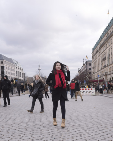 Berlin,Bundesrepublik Deutschland- December 29,2016: Unter den Linden - one of the main and most famous boulevard, got its name because of its decorating lindens. Tourists walk along the boulevard and photographedのeditorial素材