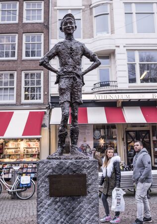 Amsterdam,Netherlands-December 30,2016:Spui Square.Het Amsterdamse Lieverdje (the Little Amsterdam Darling).Hes got a rascally glint in his eye and a mischievous, impish grinのeditorial素材