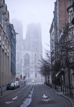 Brussels, Belgium-December 31,2016:Cathedral of Saints Michael and Gudule in cloudy weather. The street car is movingのeditorial素材