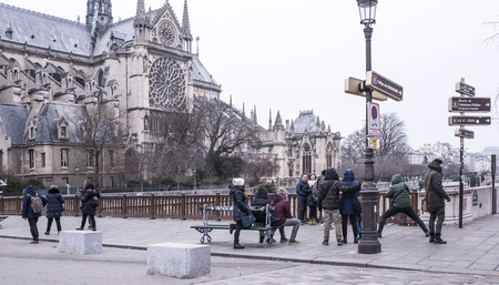 Paris, France- January 01,2017: Cathedral of Notre Dame.Tourists are walking and take picturesのeditorial素材