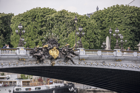 Paris,France- April 29, 2017: View of the Alexander lll Bridge. Nymph of the Neva with official symbols of Czarist Russiaのeditorial素材