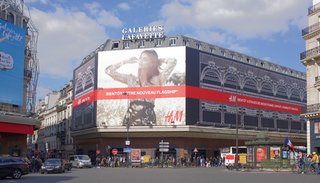 Paris,France- April 29, 2017: La Fayette shopping center, view from the Boulevard Haussmann.On the street pedestrians and moving vehiclesのeditorial素材