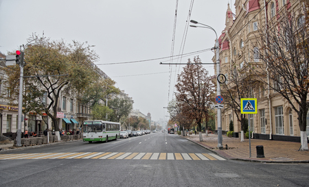 Rostov-on-Don,Russia - October 21,2017: The street Bolshaya Sadovaya misty autumn.Workers reconstruct the pavement. On the street cars and pedestrians moveのeditorial素材